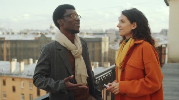 Elegant Afro American Man Standing Rooftop Terrace Chatting Beautiful Caucasian — Stock Video