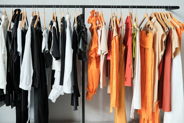 New clothes hanging on the rack — Stock Photo, Image