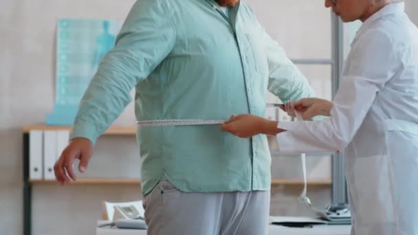 Midsection Shot Doctor Measuring Waist Overweight Man Tape Medical Checkup — Stock Video