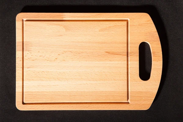 Cutting board on a dark background — Stock Photo, Image