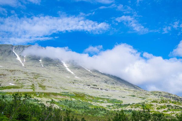 on the way  to the summit of the Gaustatoppen in Norway on a beautiful summer day