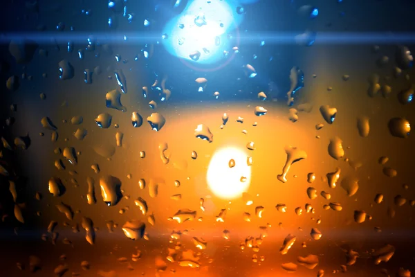 Gotas de agua con luz de vela — Foto de Stock