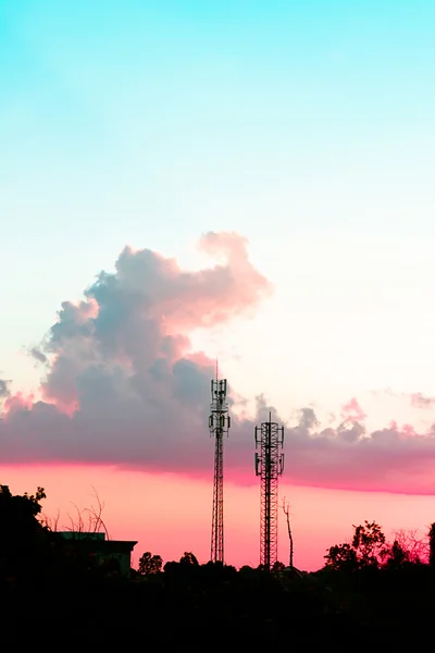 sunset sky with silhouette antenna