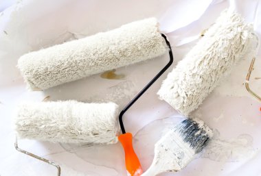 brushes and rollers for paint on wall 
