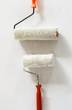brushes and rollers for paint on wall 