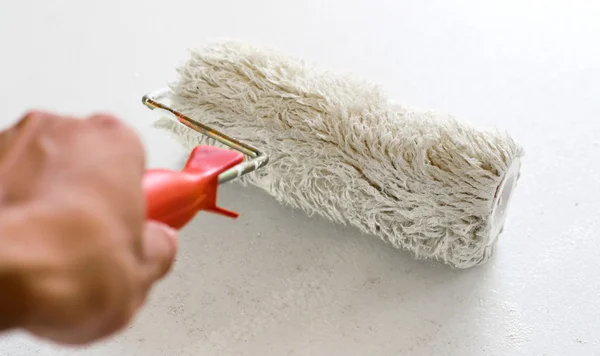 Brushes and rollers for paint on wall — Stock Photo, Image