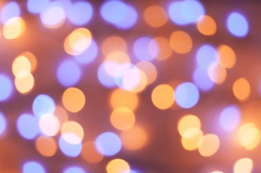 Şenlikli çelenk Bokeh arka planı çözüldü. Tebrik kartları ve kartpostallar için arka plan. Yuvarlak top. Yuvarlak bokeh ışığı.