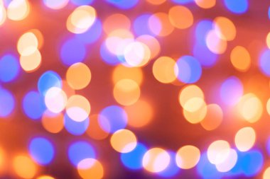 Şenlikli çelenk Bokeh arka planı çözüldü. Tebrik kartları ve kartpostallar için arka plan. Yuvarlak top. Yuvarlak bokeh ışığı.