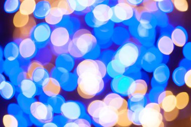 Şenlikli çelenk Bokeh arka planı çözüldü. Tebrik kartları ve kartpostallar için arka plan. Yuvarlak top. Yuvarlak bokeh ışığı.