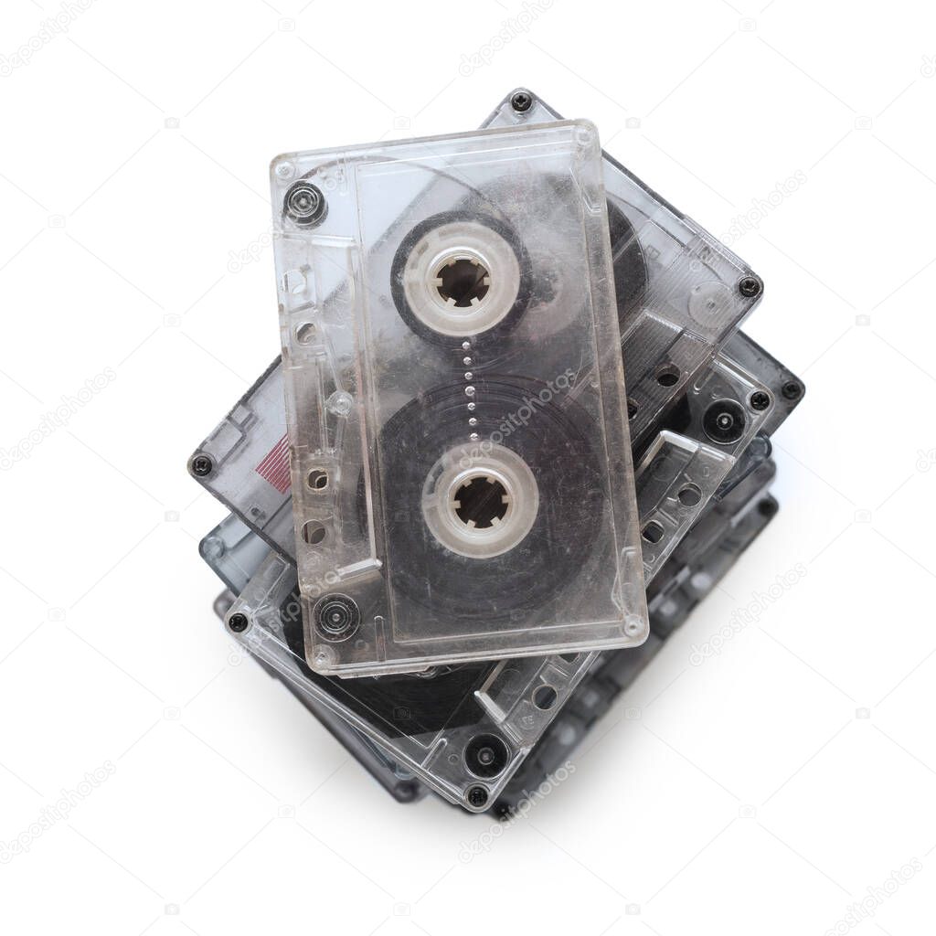 Collection of music cassettes stack isolated on white background.