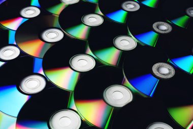 CD disk arkaplanı. Sıkıştırılmış disk koleksiyonu dekorasyonu.