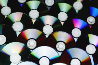 CD disk arkaplanı. Sıkıştırılmış disk koleksiyonu dekorasyonu.