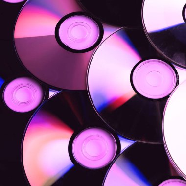 CD disk arkaplanı. Sıkıştırılmış disk koleksiyonu dekorasyonu.