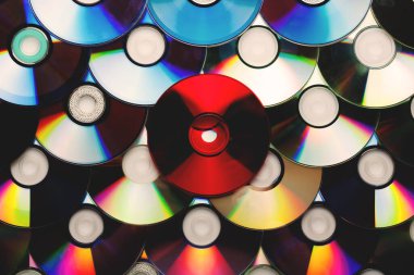 CD disk arkaplanı. Sıkıştırılmış disk koleksiyonu dekorasyonu.