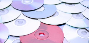 CD disk arkaplanı. Sıkıştırılmış disk koleksiyonu dekorasyonu.