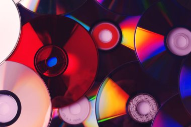 CD disk arkaplanı. Sıkıştırılmış disk koleksiyonu dekorasyonu.
