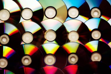 CD disk arkaplanı. Sıkıştırılmış disk koleksiyonu dekorasyonu.