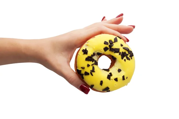 Mão Feminina Segura Com Dedos Donut Esmalte Amarelo Isolado Fundo — Fotografia de Stock