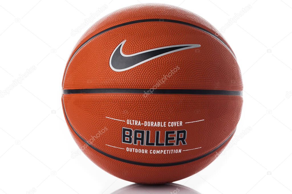 Nike brand, basketball ball Nike Baller. Orange rubber outdoor ball, ultra-durable cover, close-up on a white background.