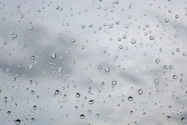 Gotas de água chuva janela — Fotografia de Stock