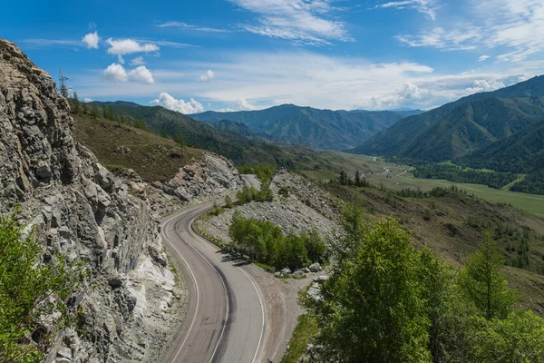 Mountain valley forest sky road — Stock fotografie