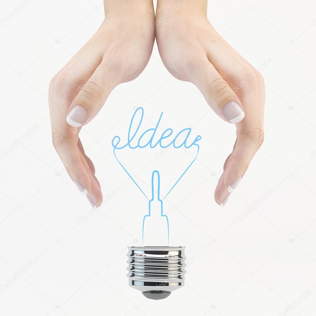 Light bulb in human hand.
