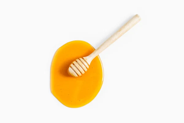 Honey with wood stick on white background — Stock Photo, Image