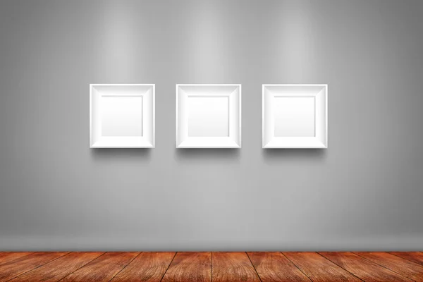 Colagem de três molduras brancas na parede — Fotografia de Stock