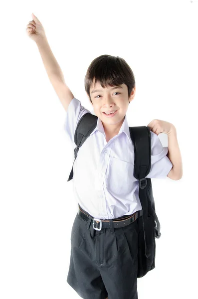 Liten student pojke i uniform på vit bakgrund — Stockfoto