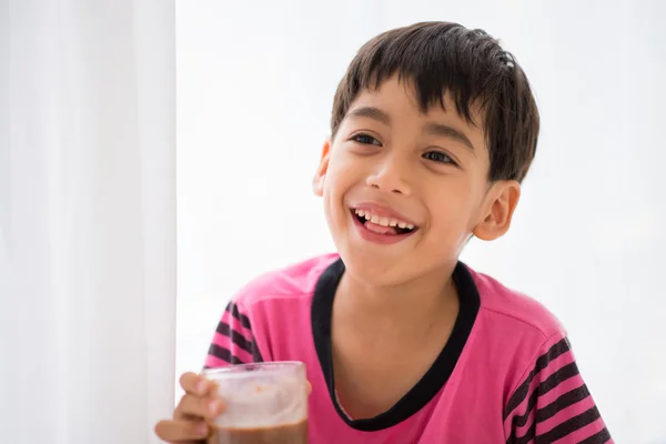 Little boy drinking milk vintage color style — Stock Photo, Image