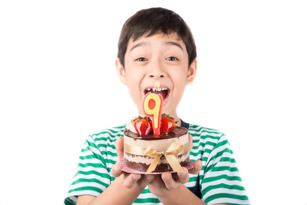 Little boy blowing candle on the cake for his birthday — Stock Photo, Image