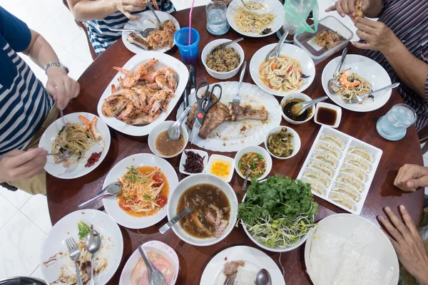 Family meal time full of food on the table