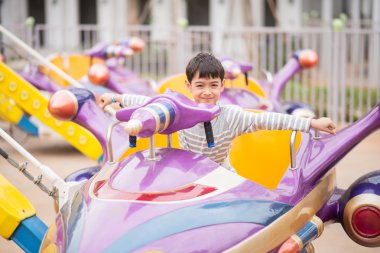 Little boy in amusement park