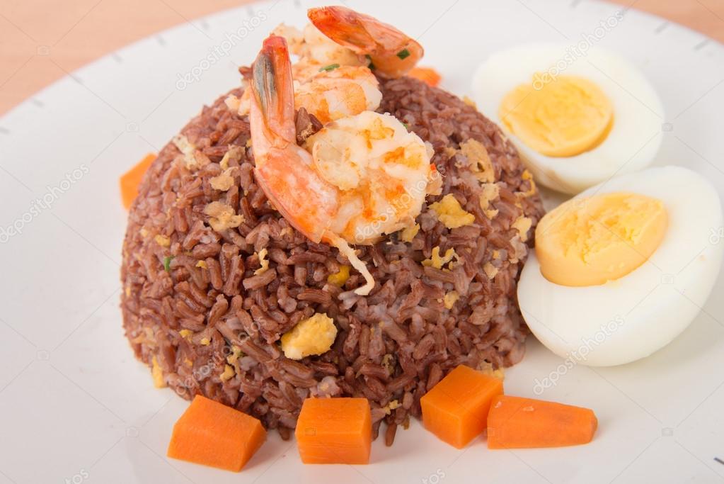 Fired brown rice with shrimp, carrot  and boiled egg healthy clean food none oil added low fat