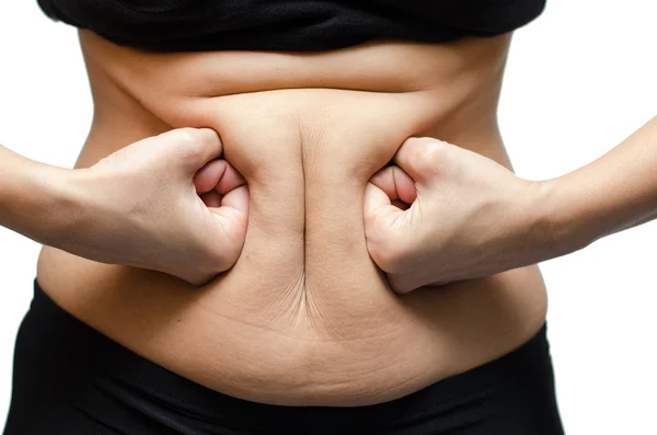 Frau schlägt mit der Hand auf Bauch — Stockfoto