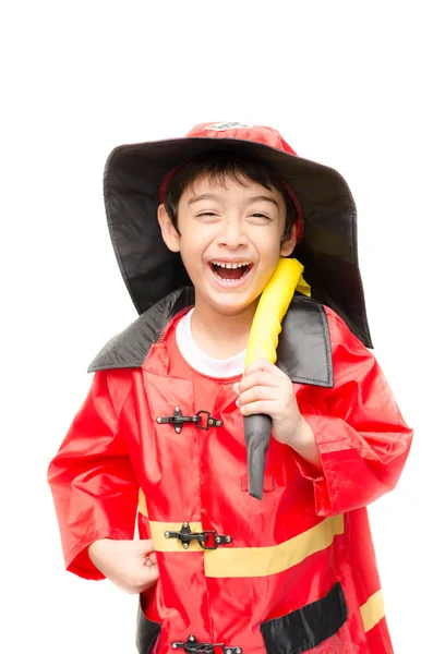 Liten pojke låtsas som en brandman på vit bakgrund — Stockfoto