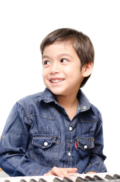 Little boy playing keyboard on white background — Stock Photo, Image