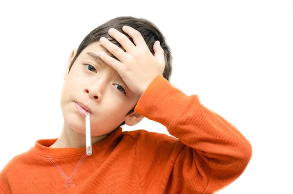 Little sick boy with temperature in mouth on white background — Stock Photo, Image