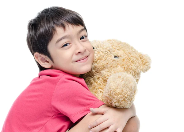 Malý chlapec drží medvídek na bílé backgground — Stock fotografie
