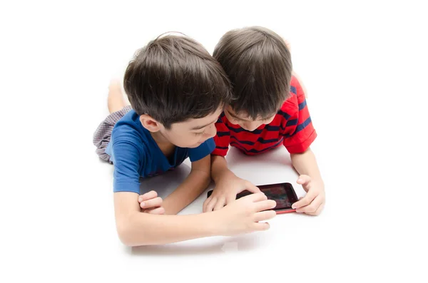 Happy little sibling boy use tablet on white background — Stock Photo, Image