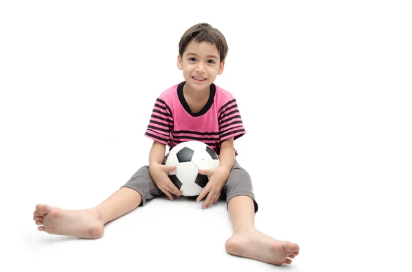 Menino segurando futebol no fundo branco — Fotografia de Stock