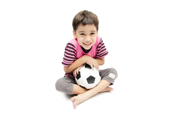 Menino segurando futebol no fundo branco — Fotografia de Stock