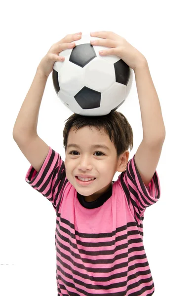 Liten pojke håller fotboll på vit bakgrund — Stockfoto
