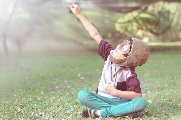 Little boy play as pilot in the park vintage color — Stock Photo, Image