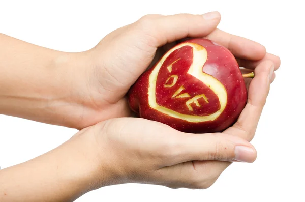 Apple,heart,love in woman hand on white background — Stock Photo, Image