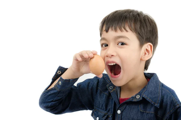 Little boy holding egg in hand mouth wide healthy on white backg — Stock Photo, Image