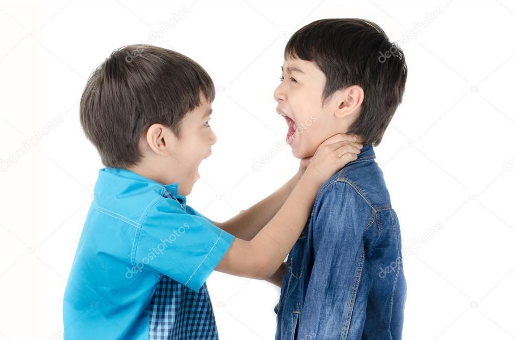 Little sibling boy fighting on white background