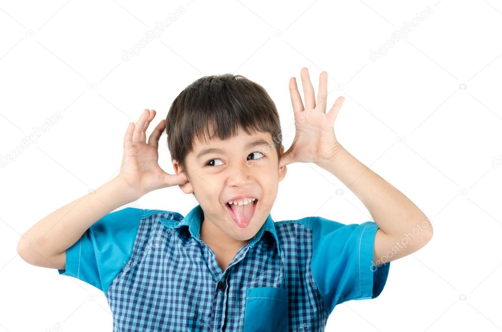 Little boy with funny face tongue outside on white background