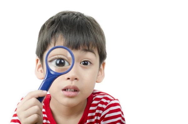 Little boy using magnifier close up on white background — Stock Photo, Image