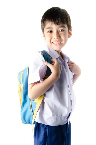 Petit étudiant garçon en uniforme sur fond blanc — Photo